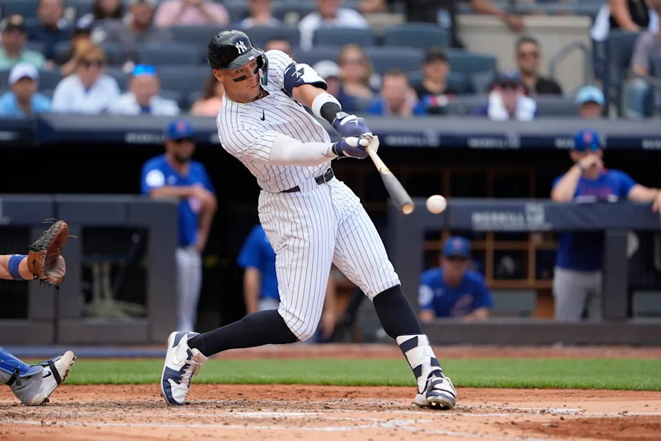 Jul 12, 2025; Bronx, New York, USA; New York Yankees right fielder Aaron Judge (99) hits a double during the fourth inning at Yankee Stadium. Mandatory Credit: Gregory Fisher-Imagn Images