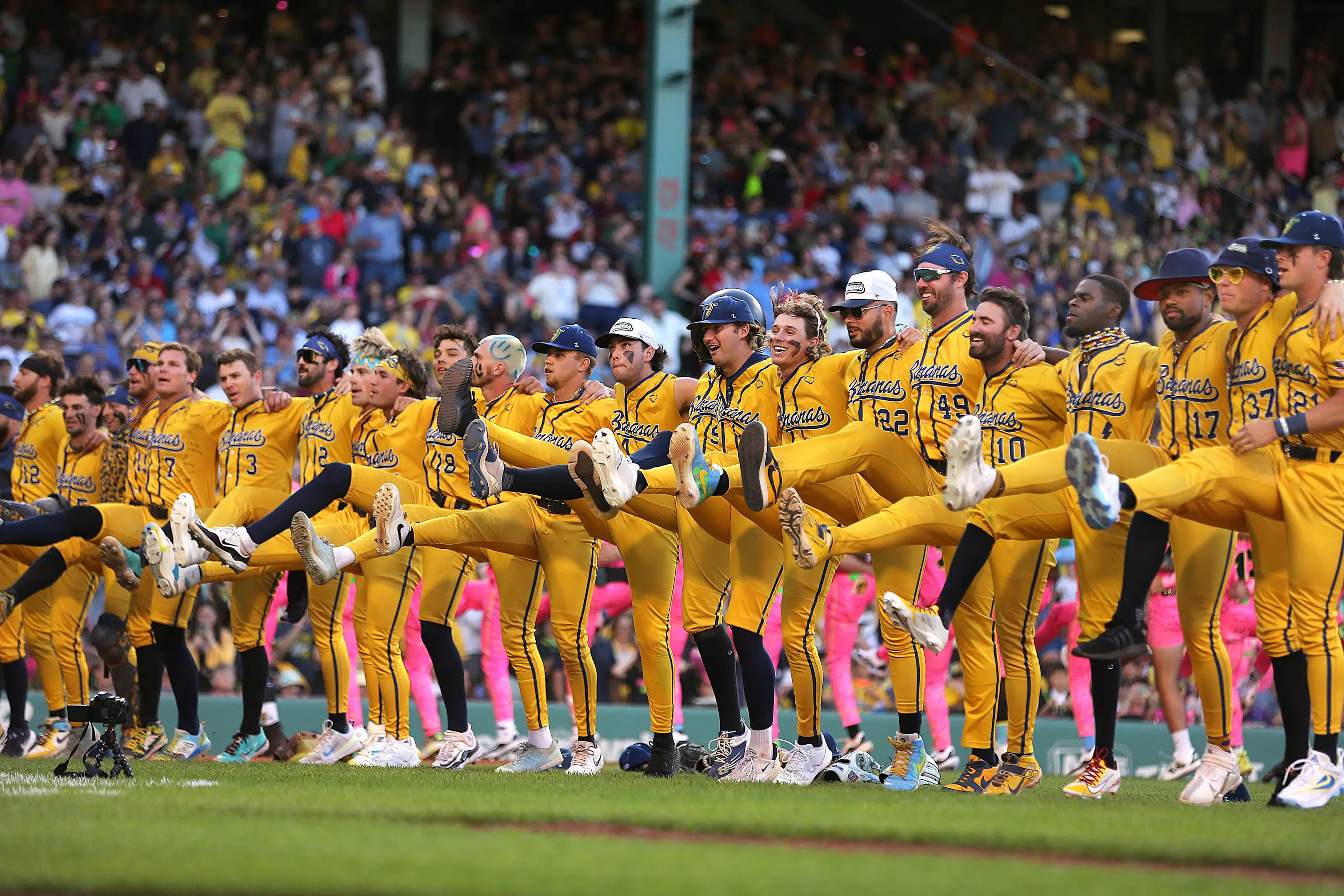 Boston, MA - June 8: The Savannah Bananas do a line dance on the infield in the second inning. (Photo by John Tlumacki/The Boston Globe via Getty Images)