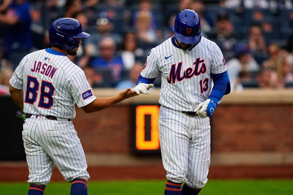 New York Mets’ Luis Torrens (13) celebrates while walking during the sixth inning of a baseball game against the Cincinnati Reds, Saturday, July 19, 2025, in New York. AP