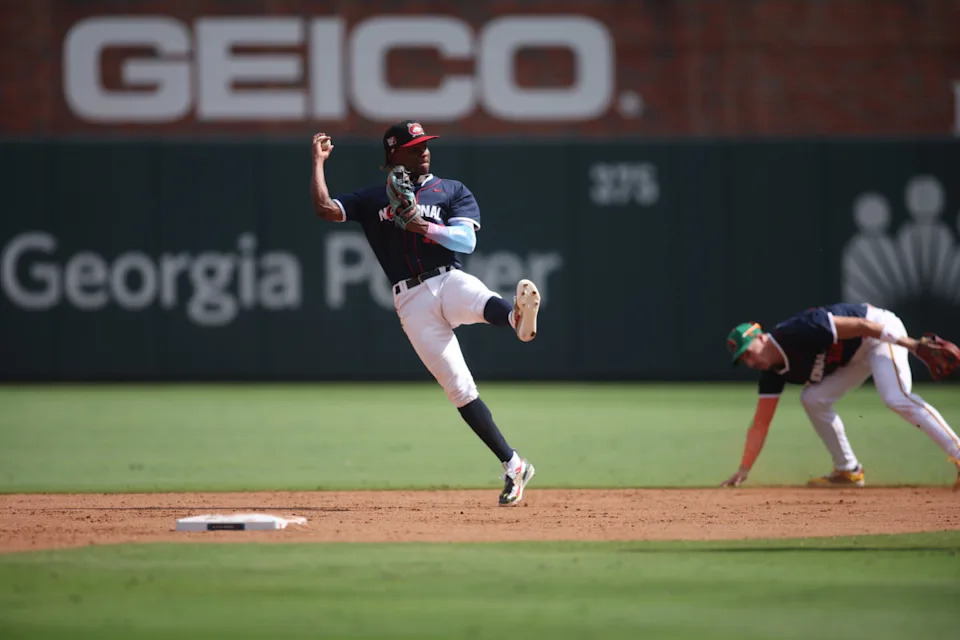 Jul 12, 2025; Atlanta, GA, USA; National League infielder Jesus Made (12) of the Milwaukee Brewers catches and throws a pass during the third inning against American League at Truist Park. Mandatory Credit: Brett Davis-Imagn Images