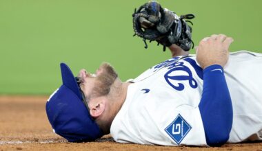 Dodgers infielder helped off field after tag