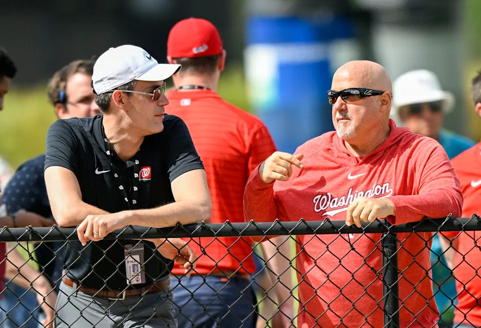 WEST PALM BEACH, FL - FEBRUARY 17:  Washington Nationals president and general manager Mike Rizzo (R) talks with assistant GM Mike DeBartolo during spring training workouts at the training complex on February 17, 2023.  (Photo by Jonathan Newton/The Washington Post via Getty Images)
