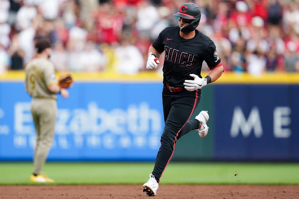 Spencer Steer rounds the bases after one of three home runs against the Padres on Friday.