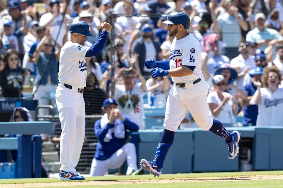 Fans cheer as the Dodgers' Max Muncy rounds the bases after hitting a grand slam on June 22 against the Washington Nationals.