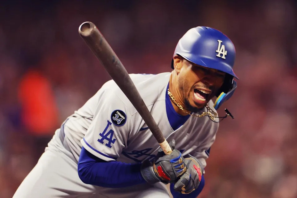 Mookie Betts grimaces in pain after being hit by a pitch in the sixth inning against the Giants on Friday night.