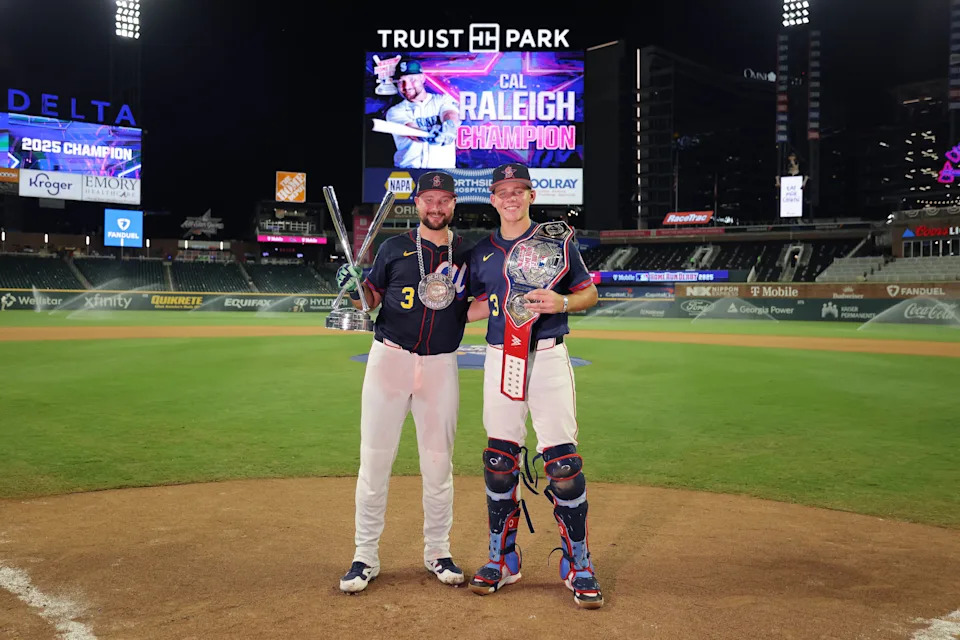 ATLANTA, GEORGIA - JULY 14: Cal Raleigh #29 of the Seattle Mariners and his brother Todd Raleigh Jr. pose with the trophy and belt after the Home Run Derby at Truist Park on July 14, 2025 in Atlanta, Georgia.  (Photo by Jamie Squire/Getty Images)