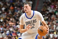 Dallas Mavericks forward Cooper Flagg (32) handles the ball against the Los Angeles Lakers...