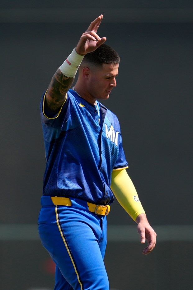 Minnesota Twins' Jose Miranda acknowledges the crowd after hitting a fly out to end his streak of 12 consecutive at-bats with a hit during the sixth inning of a baseball game against the Houston Astros Saturday, July 6, 2024, in Minneapolis. (AP Photo/Abbie Parr)