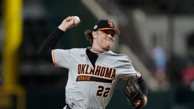 Oklahoma State pitcher Gabe Davis (22) throws during an NCAA baseball game against Clemson on Friday, Feb. 14, 2025, in Arlington, Texas. (AP Photo/Brandon Wade)