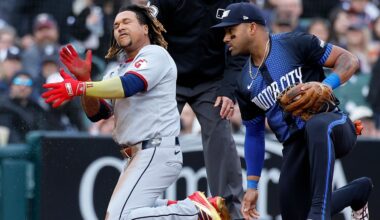 Cleveland Guardians' José Ramírez, left, celebrates after his triple that drove in Steven Kwan in front of third baseman Detroit Tigers' Andy Ibáñez, right, during the first inning of a baseball game Friday, May 23, 2025, in Detroit.