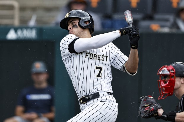 Wake Forest infielder Marek Houston (7) connects for a hit during an NCAA baseball game against Cincinnati on Friday, May 30, 2025, in Knoxville, Tenn. (AP Photo/Wade Payne)