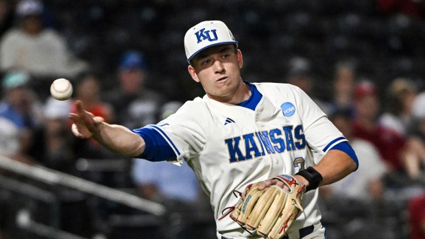 Kansas infielder Brady Counsell throws to first base against Creighton on May 30, 2025, in Fayetteville, Ark. (AP Photo/Michael Woods)