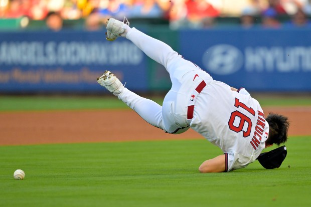 Angels starting pitcher Yusei Kikuchi loses his glove and flips...