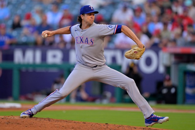 Texas Rangers starting pitcher Jacob deGrom throws to the plate...