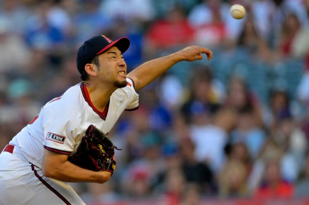 Angels starting pitcher Yusei Kikuchi throws to the plate during...