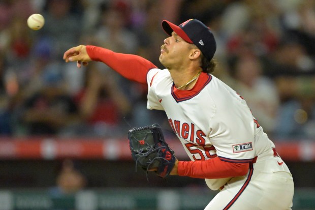 Angels relief pitcher Victor Mederos throws to the plate during...