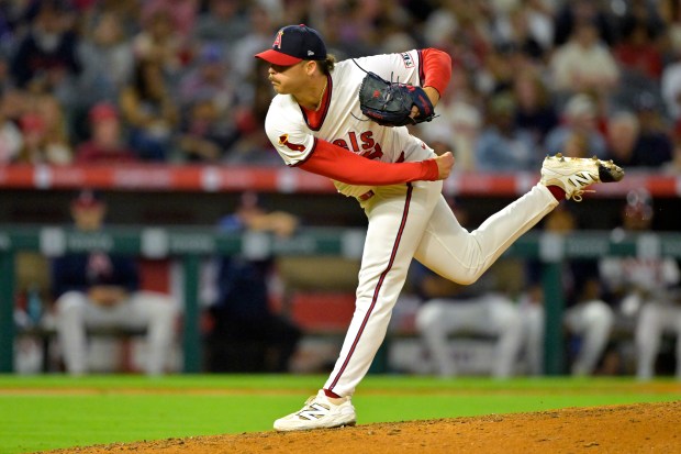 Angels relief pitcher Victor Mederos throws to the plate during...