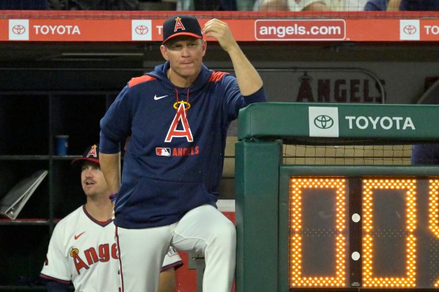 Angels interim manager Ray Montgomery looks on from the dugout...