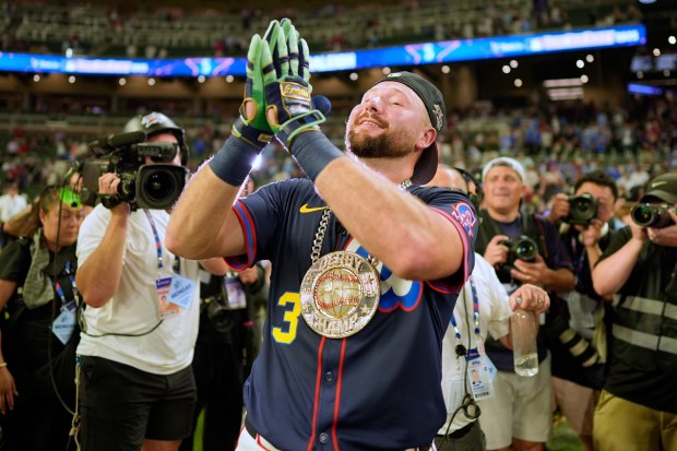 The Seattle Mariners’ Cal Raleigh celebrates after winning the MLB...