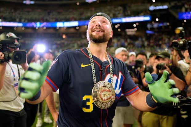 The Seattle Mariners’ Cal Raleigh celebrates after winning the MLB...