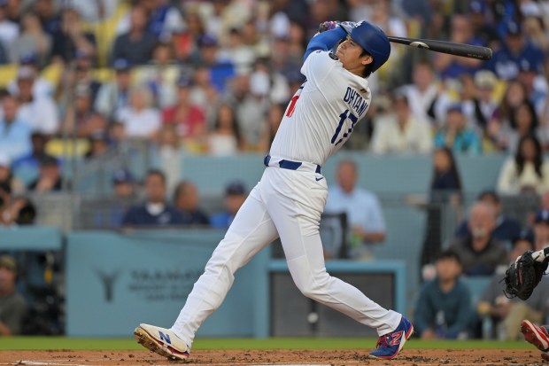 Dodgers star Shohei Ohtani hits a two-run home run during...