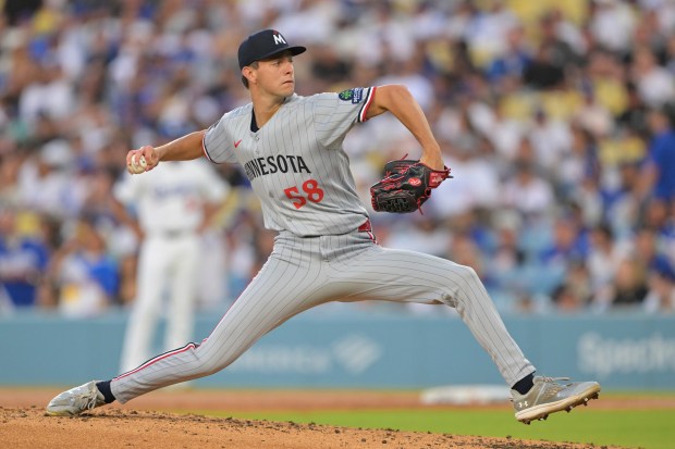 Minnesota Twins starting pitcher David Festa throws to the plate...
