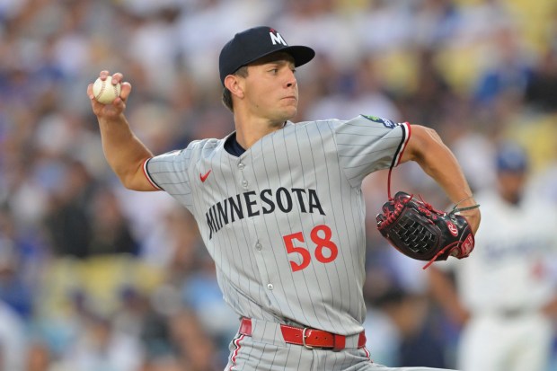 Minnesota Twins starting pitcher David Festa throws to the plate...