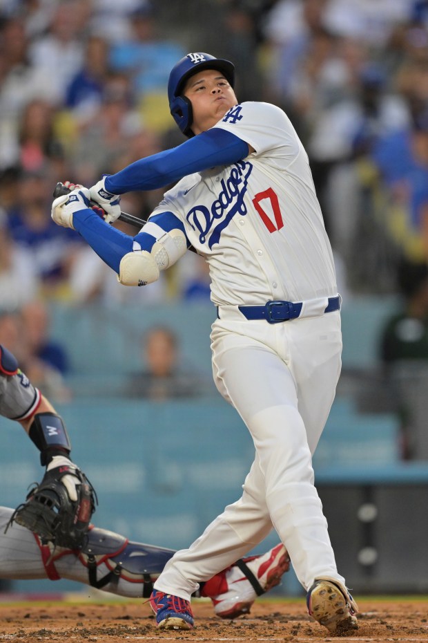 Dodgers star Shohei Ohtani hits a foul ball during the...