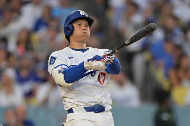 Dodgers star Shohei Ohtani hits a foul ball during the...