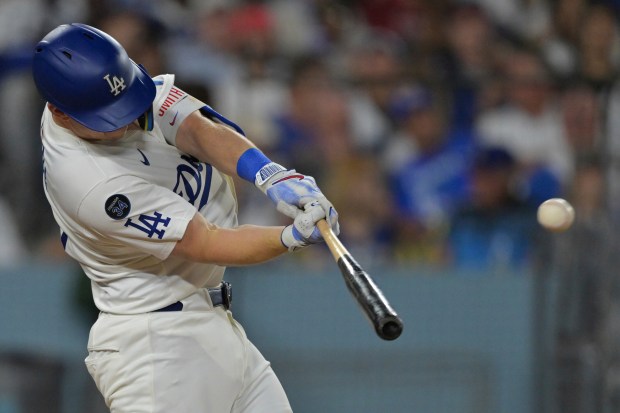 The Dodgers’ Will Smith hits his second solo home run...
