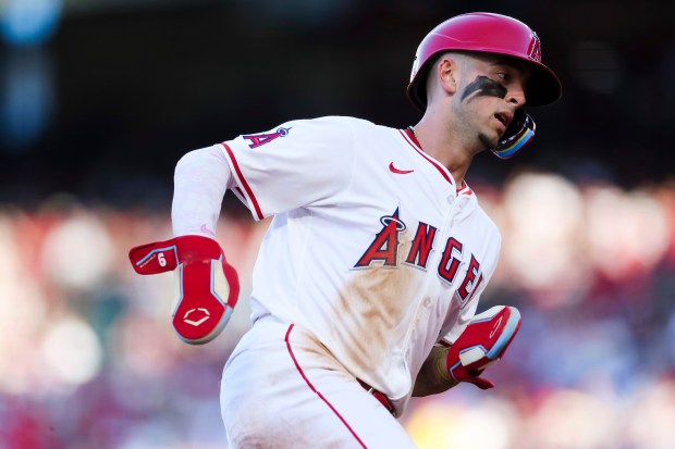 The Angels’ Zach Neto runs the bases on his way...