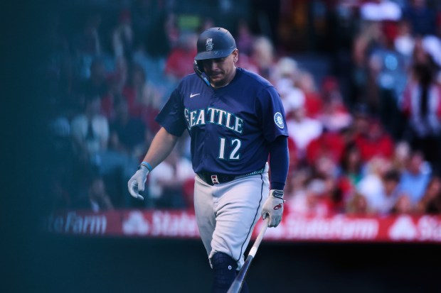 The Seattle Mariners’ Josh Naylor walks off the field after...