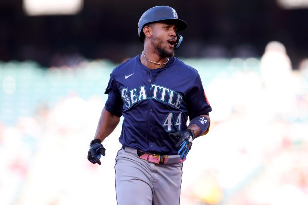 The Seattle Mariners’ Julio Rodriguez runs the bases after hitting...
