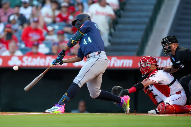 The Seattle Mariners’ Julio Rodriguez hits a solo home run...