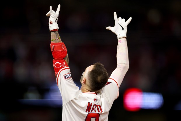 The Angels’ Zach Neto celebrates after driving in the winning...