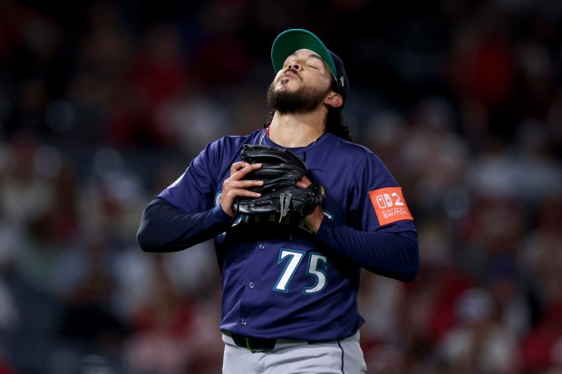 Seattle Mariners relief pitcher Andres Munoz reacts during the ninth...