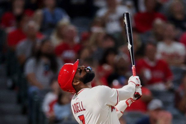 The Angels’ Jo Adell hits a fly ball during the...