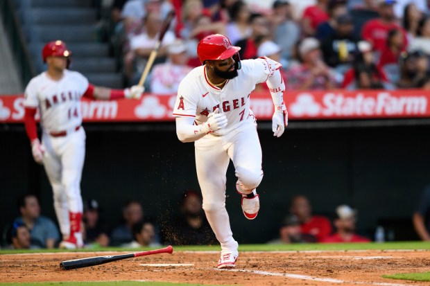 The Angels’ Jo Adell runs after hitting a single during...