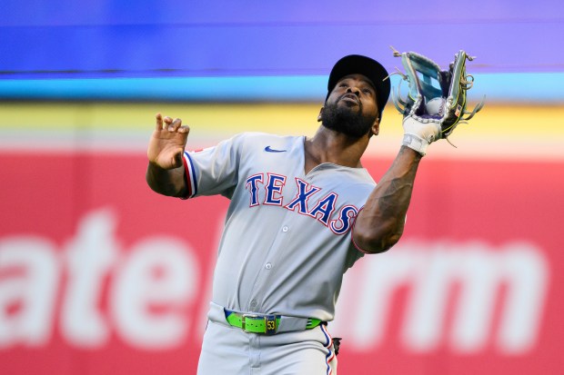 Texas Rangers right fielder Adolis García makes a catch during...