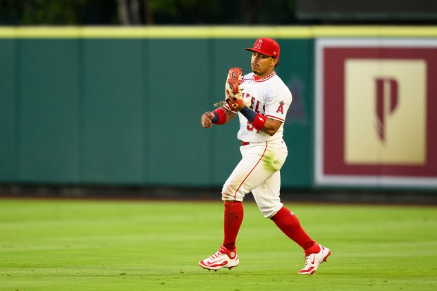 Angels right fielder Gustavo Campero makes an error while trying...