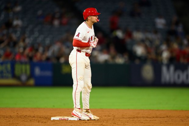 The Angels’ Logan O’Hoppe stands on second base after hitting...
