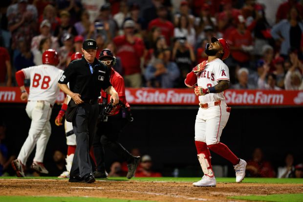 The Angels’ Luis Rengifo gestures after hitting a two-run home...