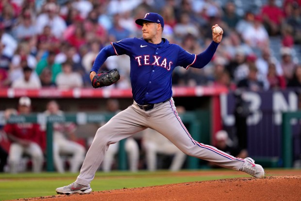 Texas Rangers starting pitcher Patrick Corbin throws to the plate...
