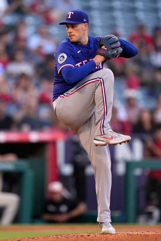 Texas Rangers starting pitcher Patrick Corbin throws to the plate...