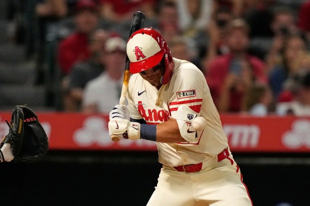 Angels star Mike Trout is hit by a pitch during...