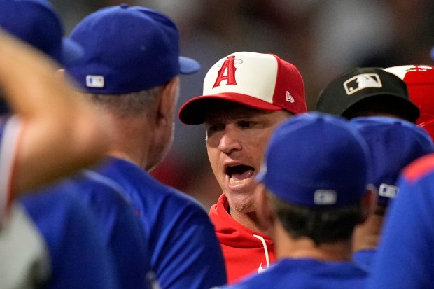 Angels interim manager Ray Montgomery, center, has words with Texas...
