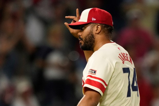 Angels relief pitcher Kenley Jansen gestures after the final out...
