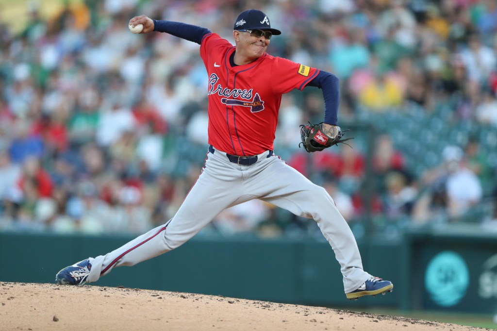 A baseball pitcher throwing a pitch.