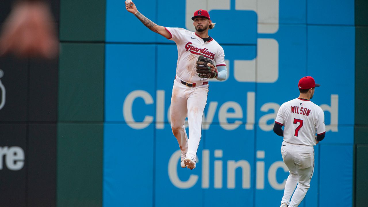 Houston Astros second baseman Brendan Rodgers, left, tags out Cleveland Guardians' Angel Martinez (1) at second base in the first inning of a baseball game in Cleveland, Friday, June 6, 2025.