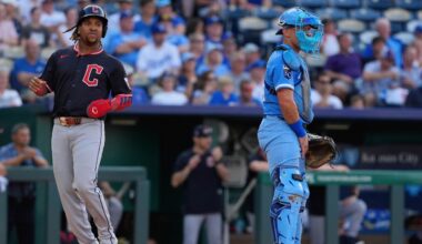 Cleveland Guardians' Steven Kwan (38) congratulates Jose Ramirez, right, after they scored on a single by Kyle Manzardo during the fourth inning of a baseball game against the Baltimore Orioles, Wednesday, July 23, 2025, in Cleveland. (AP Photo/Phil Long)